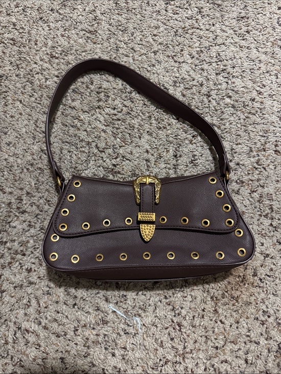 Betsey Johnson Handbags - Betsey Johnson Brown Shoulder Bag with Gold Buckle and Eyelet Accents